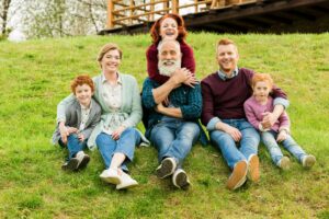 happy family resting together in village near country house