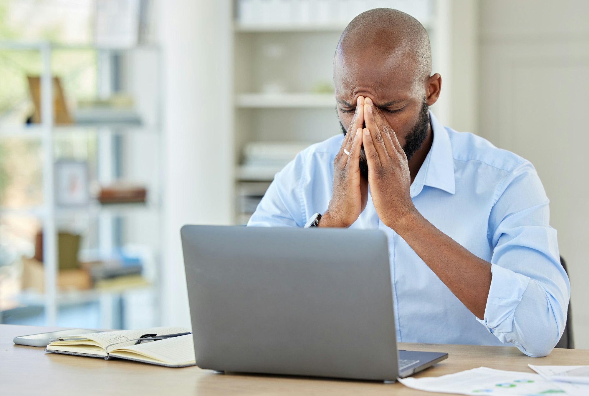 Stress, burnout and depression businessman with laptop in office with depression, anxiety and 404 c