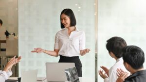 Young passionate businesswoman explaining her idea in the meeting room