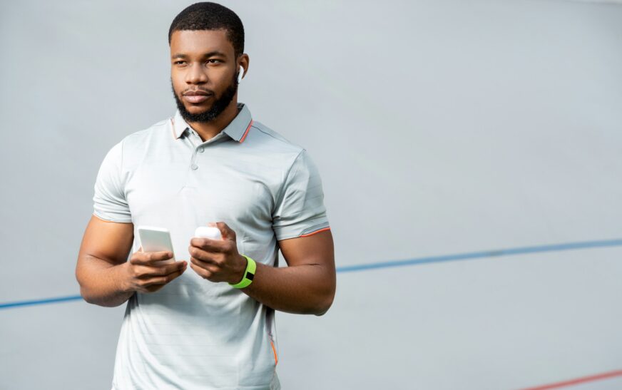 Sportive bearded young man in a gray t-shirt